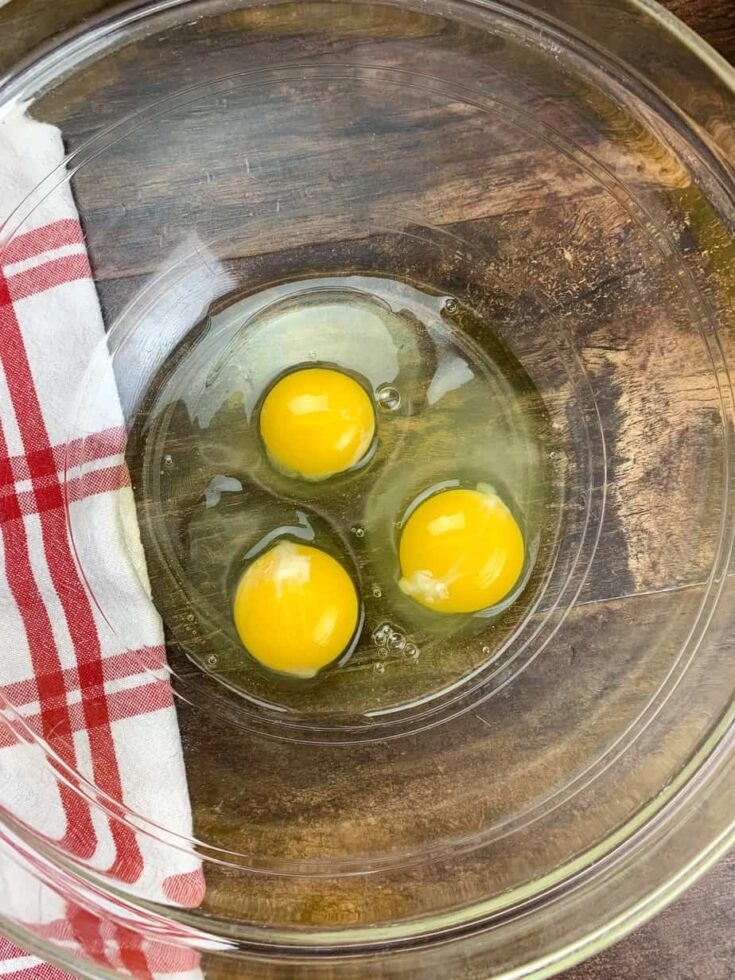 Three eggs in a glass bowl