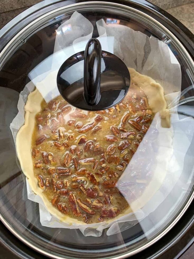 Pecan pie in a Crock Pot with the lid on. 