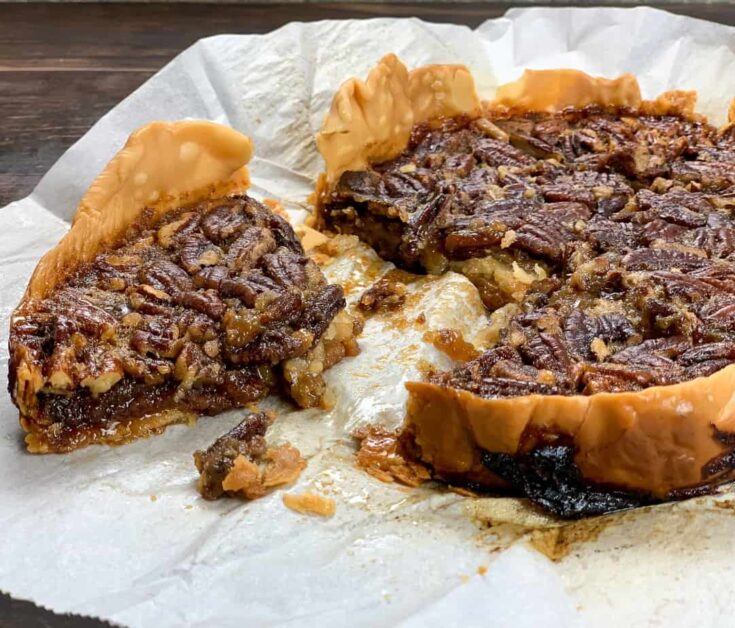 Sliced pecan pie on parchment paper