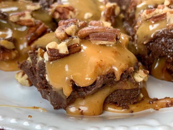 Chocolate turtle fudge on a plate.