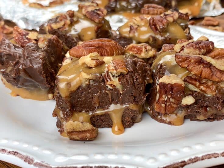 Pecan turtles on a white plate