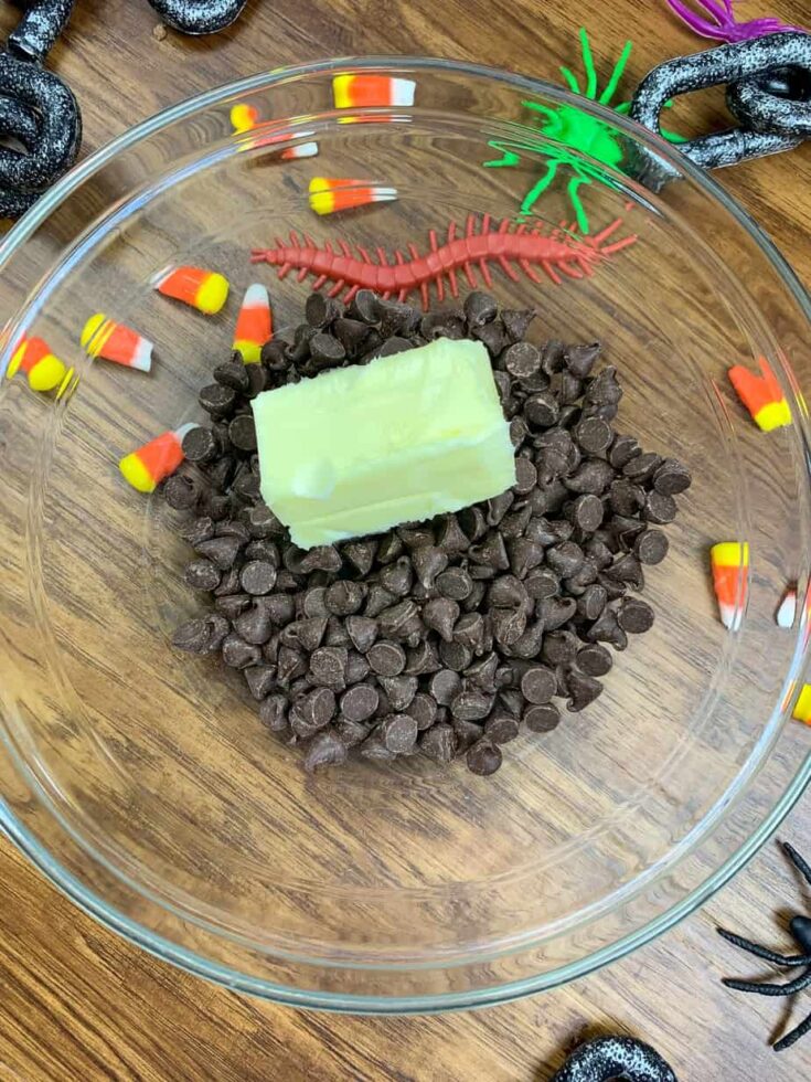 Chocolate chips and butter in a glass bowl