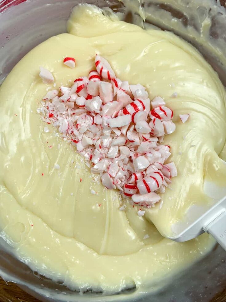 White chocolate fudge with peppermint candy in a glass bowl