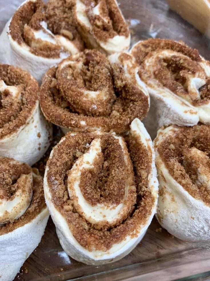 Cut up cinnamon rolls in a casserole dish