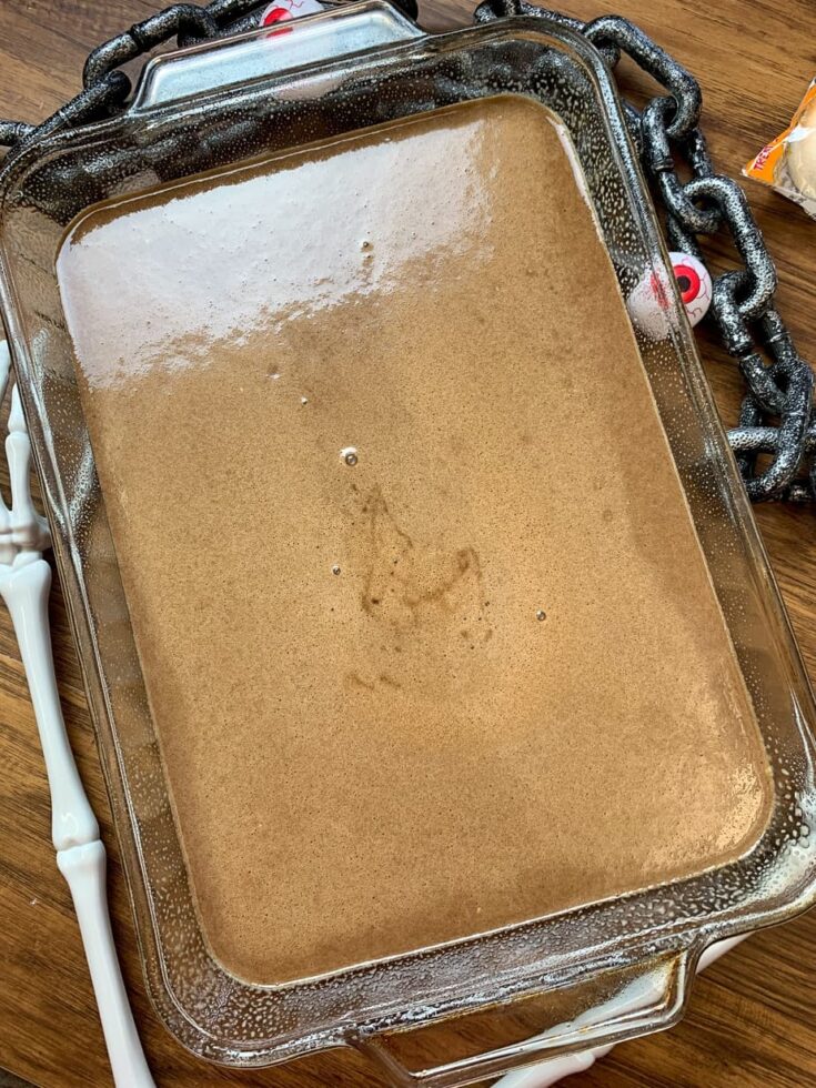 Liquid cake batter in a large glass casserole dish