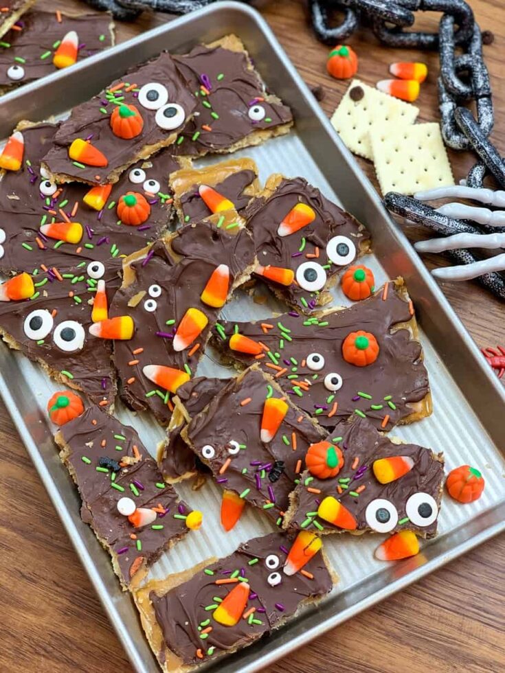 Halloween chocolate crack on a cookie sheet with candy