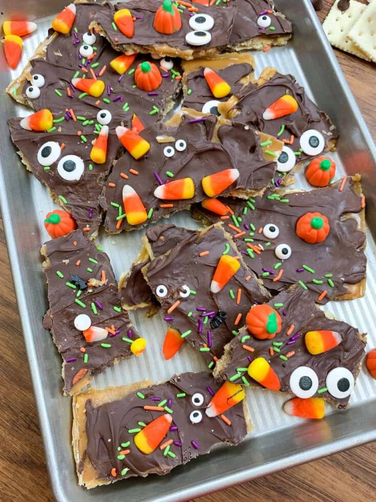 Halloween Saltine cracker toffee pieces on a cookie sheet