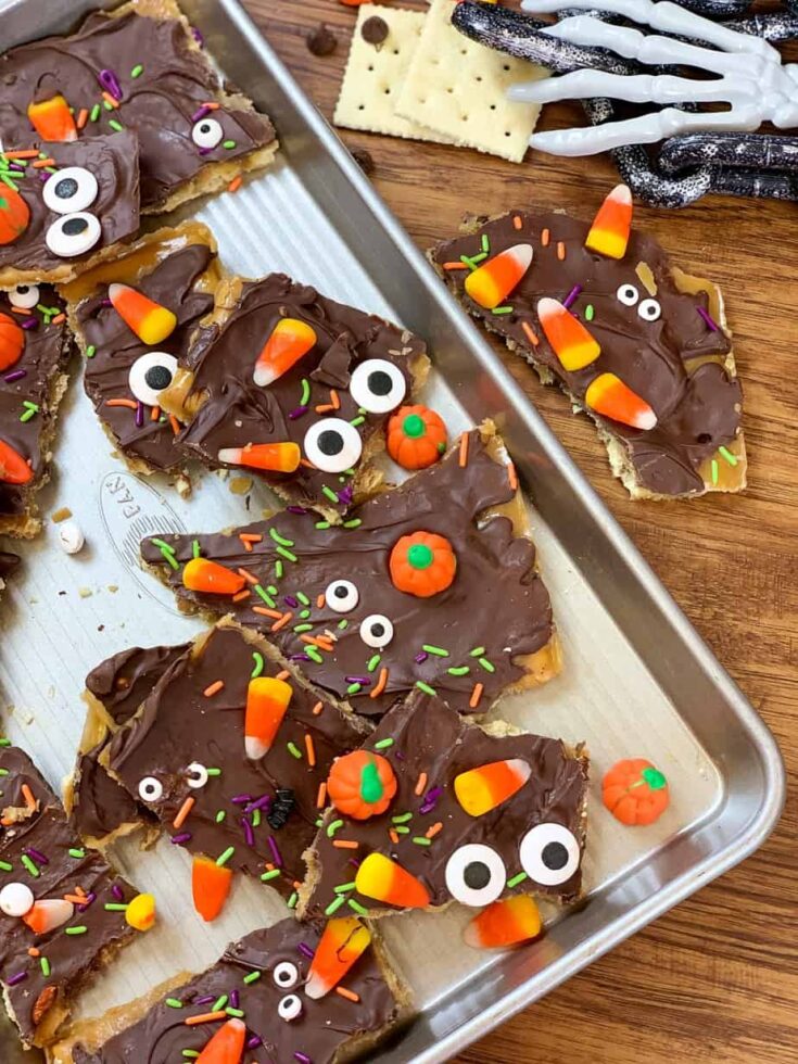 Crack candy on a cookie sheet with Halloween candy decor.