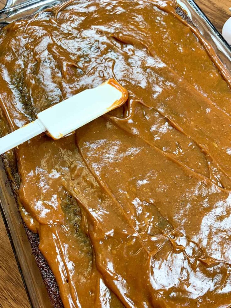 Pumpkin spice caramel on top of a poke cake