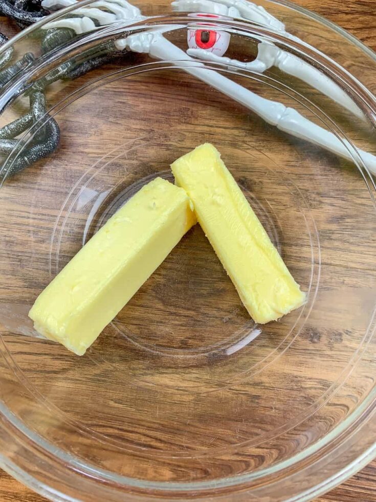 Sticks of butter in a glass bowl