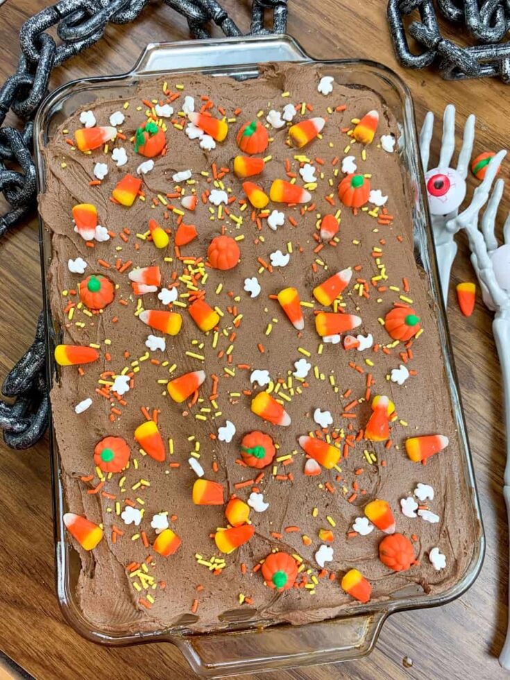 Halloween Chocolate Cake decorated with candy corn and Halloween candies