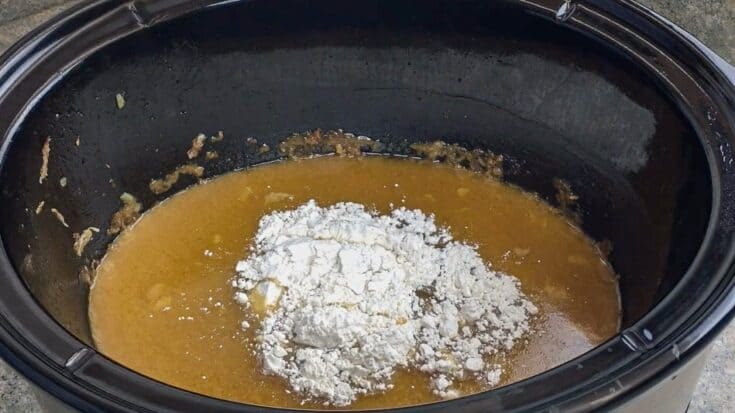 Flour in a Crock Pot with juices from pork shoulder