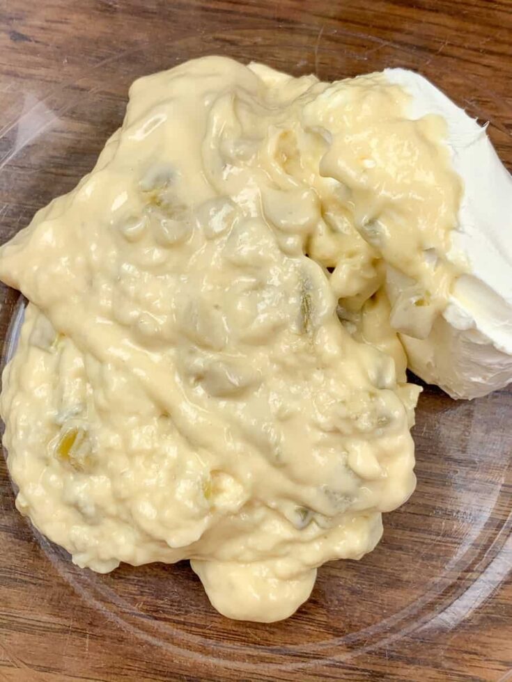 Cream cheese and cream of celery soup in a glass bowl