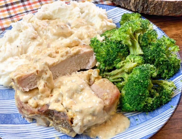 Sliced pork chops on a plate with broccoli