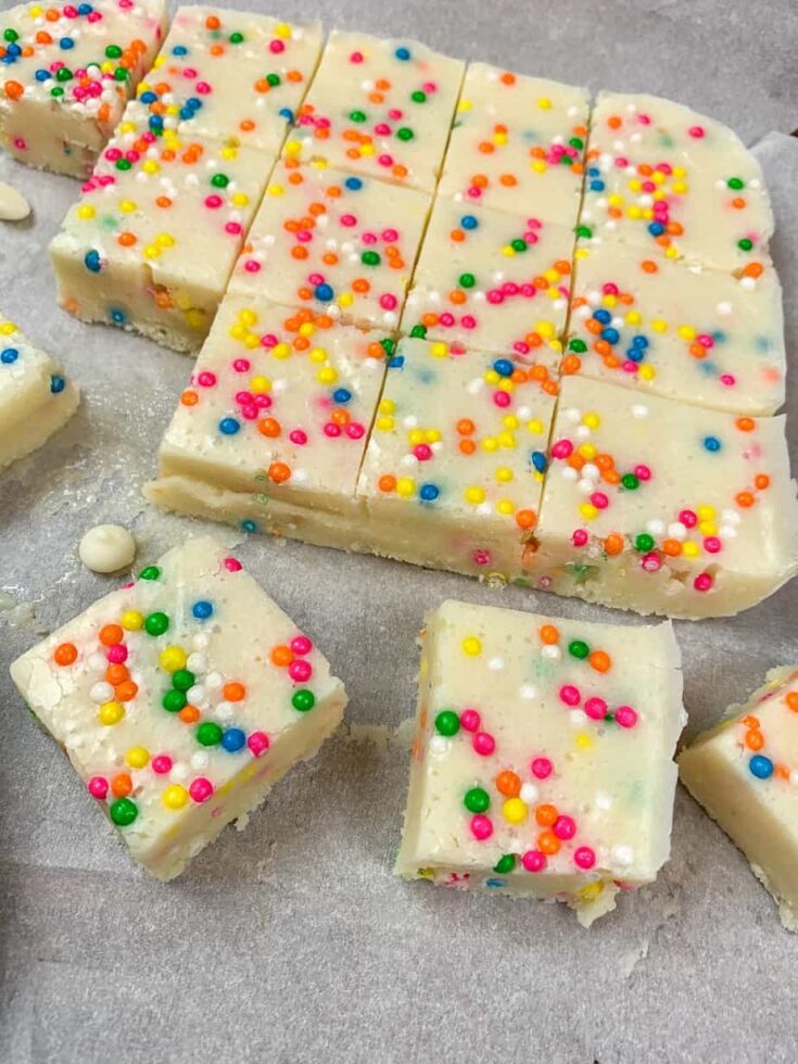 Cake batter fudge cut up on parchment paper