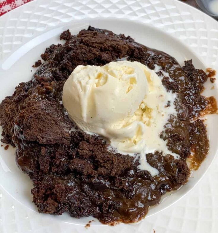 Chocolate cake with pudding and a scoop of ice cream. 