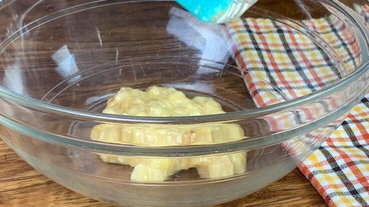 Mashed bananas in a large bowl