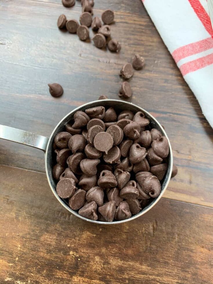 Chocolate chips in a measuring cup. 