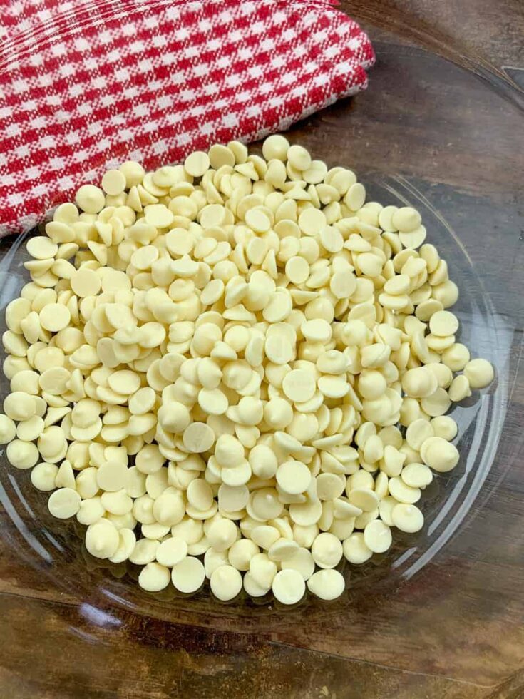 White chocolate chips in a large glass bowl