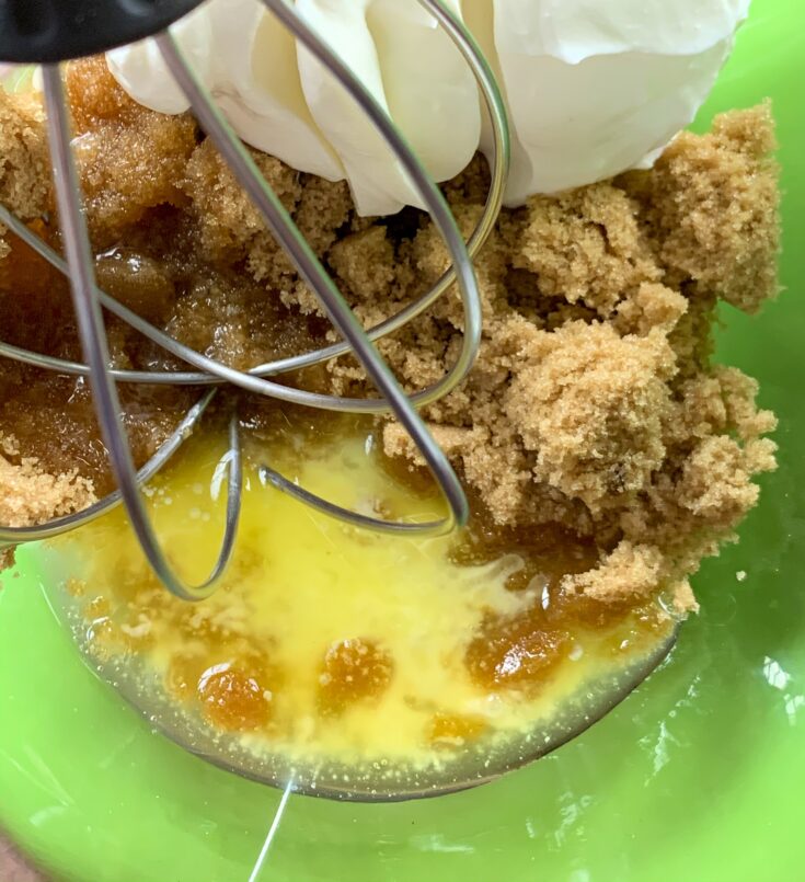 Butter, brown sugar, and sour cream in a large glass bowl to be mixed