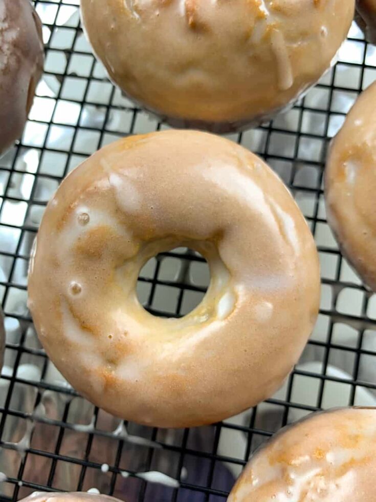 Glazed baked donuts on a cooling rackl