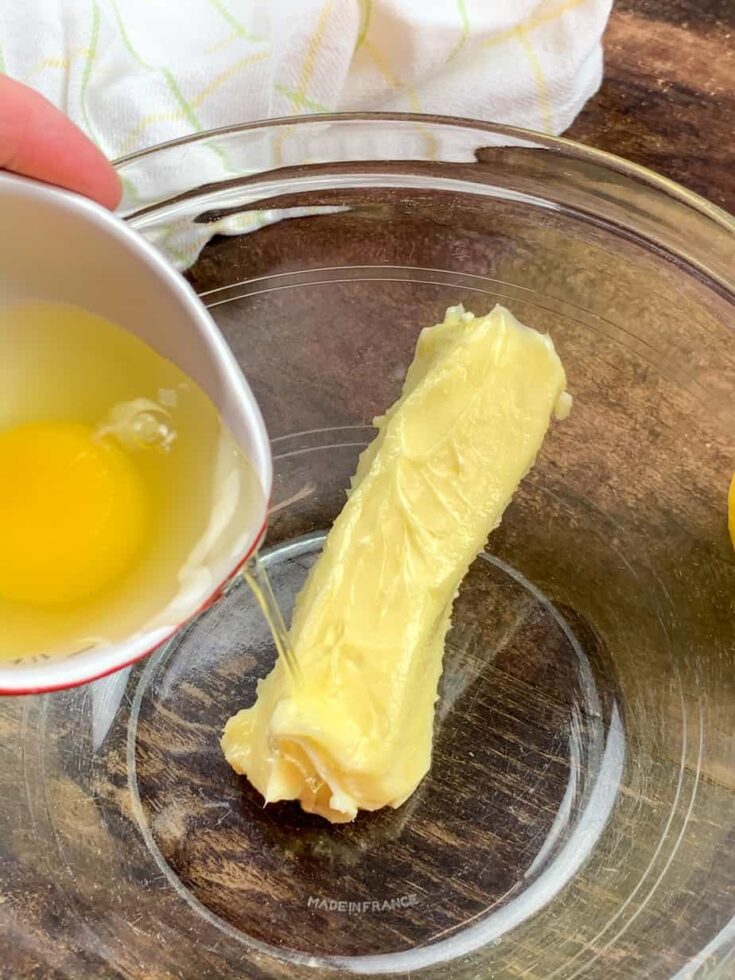 Butter and eggs in a glass bowl