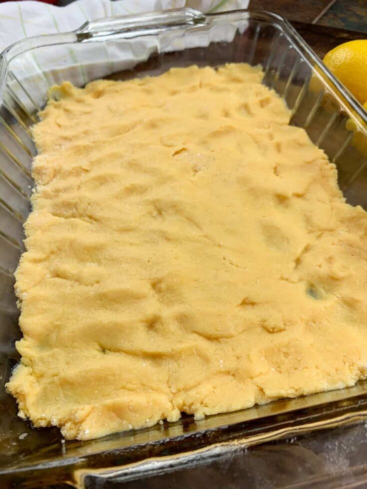 Cake mix pressed into the bottom of a 9" x 13" casserole baking dish.