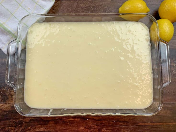 Lemon chess squares in a casserole dish ready to go into the oven