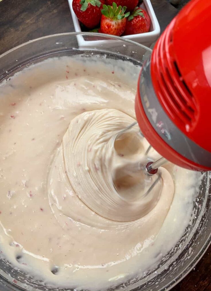 Mixing the ingredients for strawberries chess squares