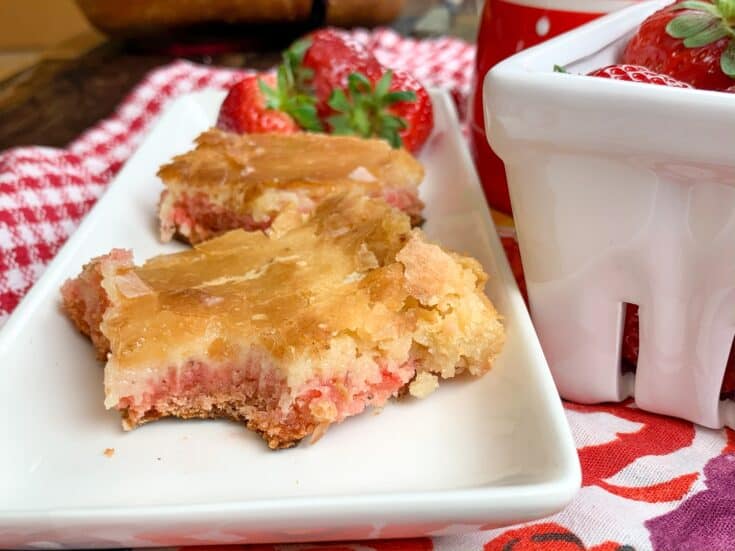 Strawberry chess squares on a plate with strawberries