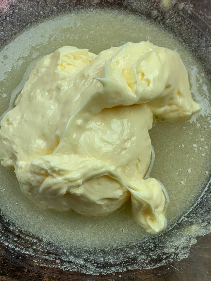 Mayonnaise in a glass bowl with sugar and vinegar for coleslaw