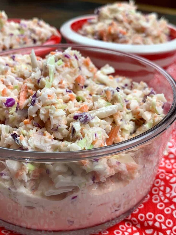 Coleslaw in a clear glass bowl