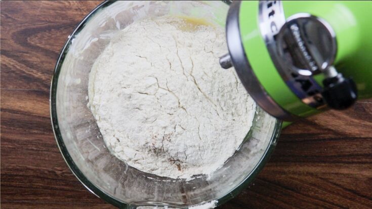 Mixing the flour into the donut batter 