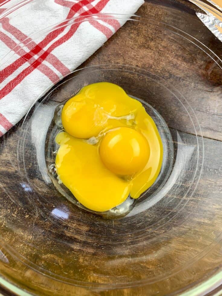 Egg yolks in a glass bowl for key lime pie