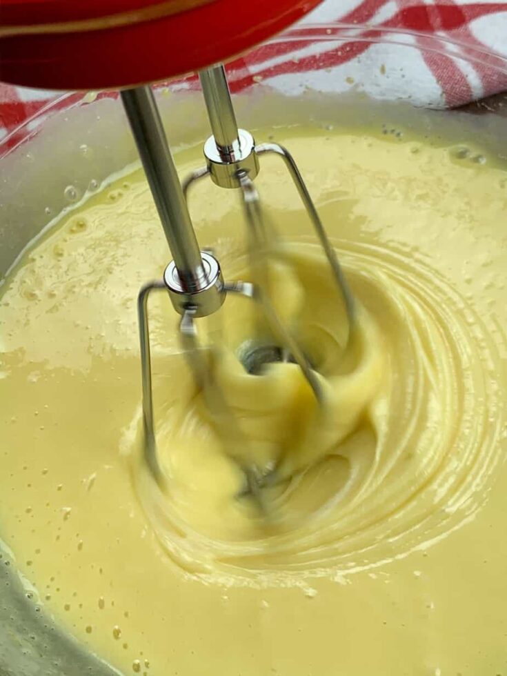 Mixing sweetened condensed milk and eggs.