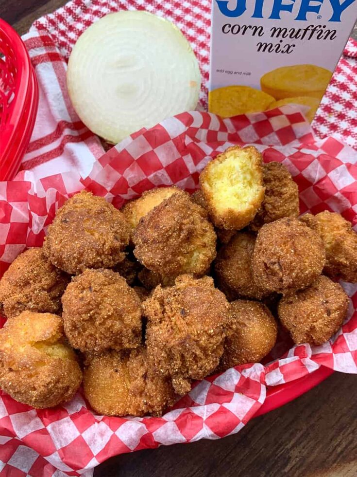 A pile of hush puppies in a basket 